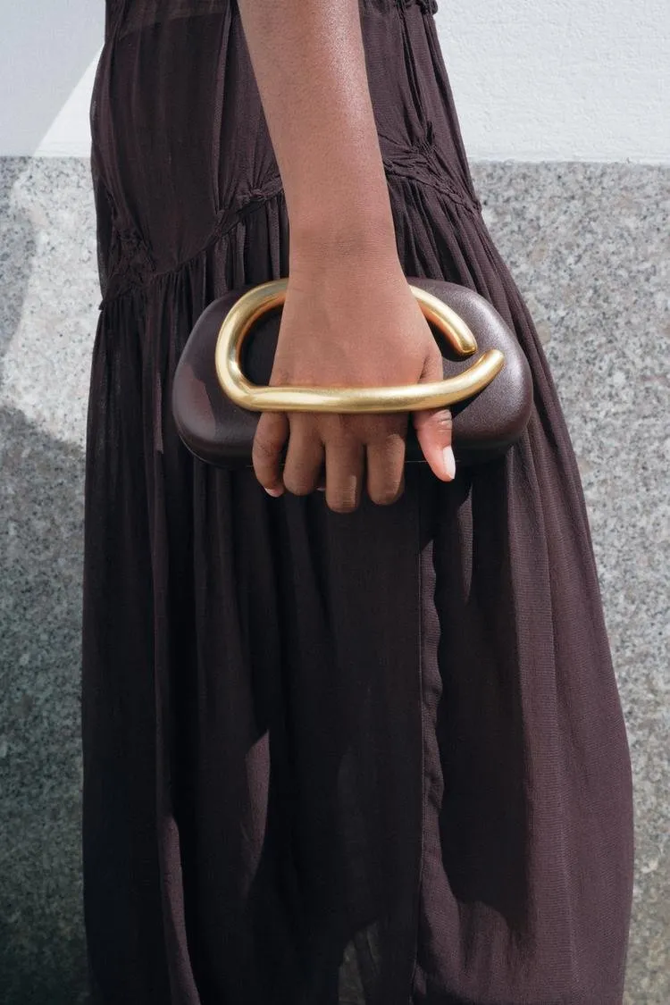Metal embellished clutch