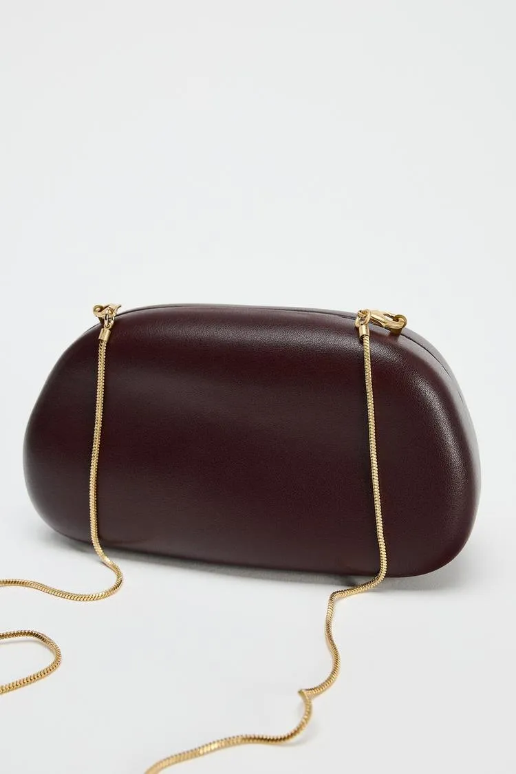 Metal embellished clutch