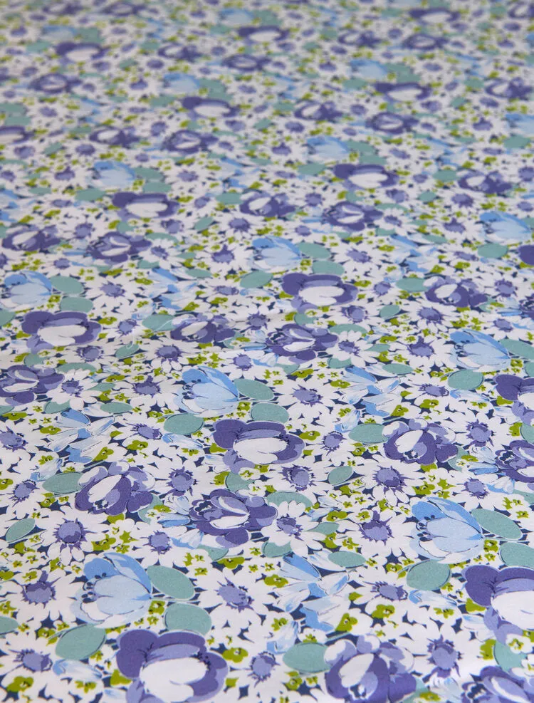 Stamattina 100% Cotton 118" Italian Percale By The Yard Margaux A multi color floral with a mix of daisies and tulips in blue/multi on optic white ground.