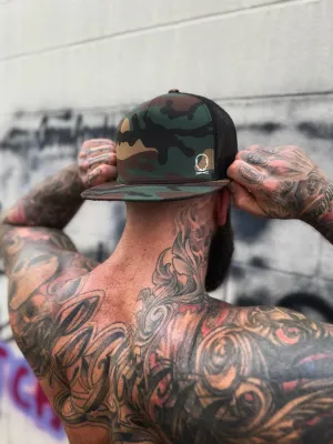 TDC SYMBOL GREEN CAMO FLAT BILL HAT